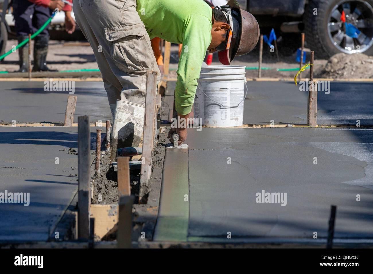 Workers finishing concrete