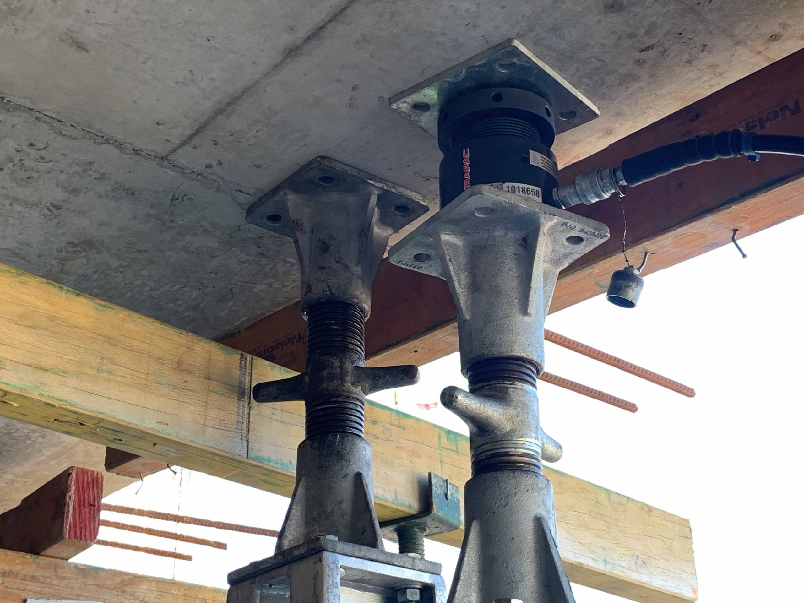 Workers operating lifting equipment